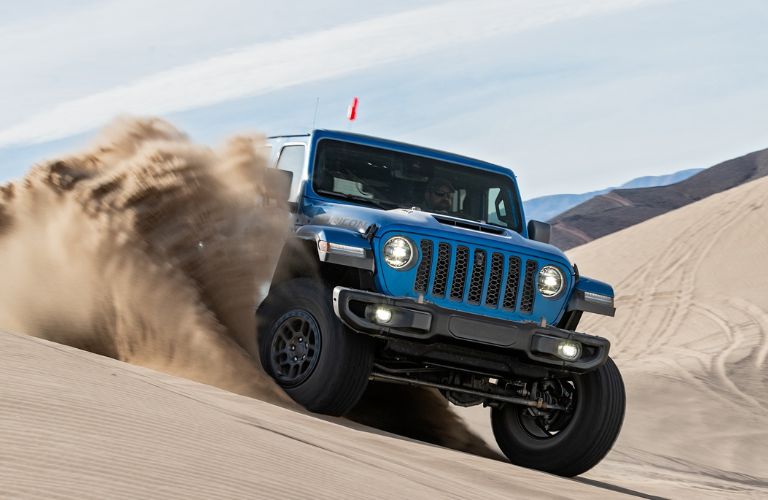 The Wrangler Rubicon with Xtreme Recon Package moving through a desert