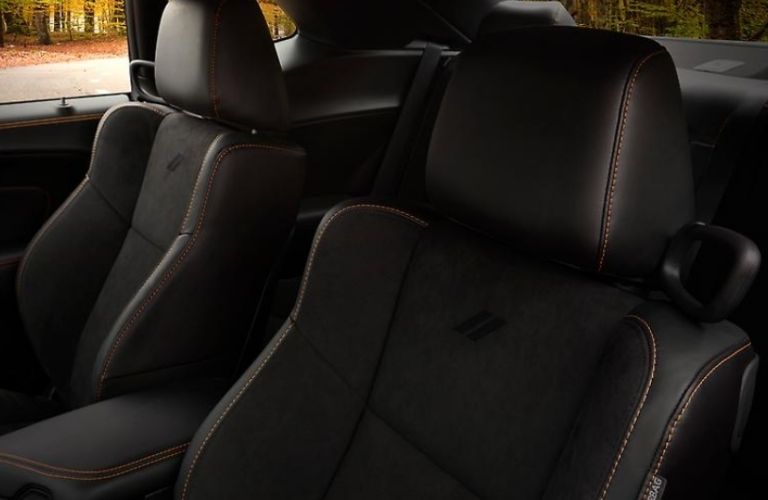 Interior seating area of the 2022 Dodge Challenger is shown